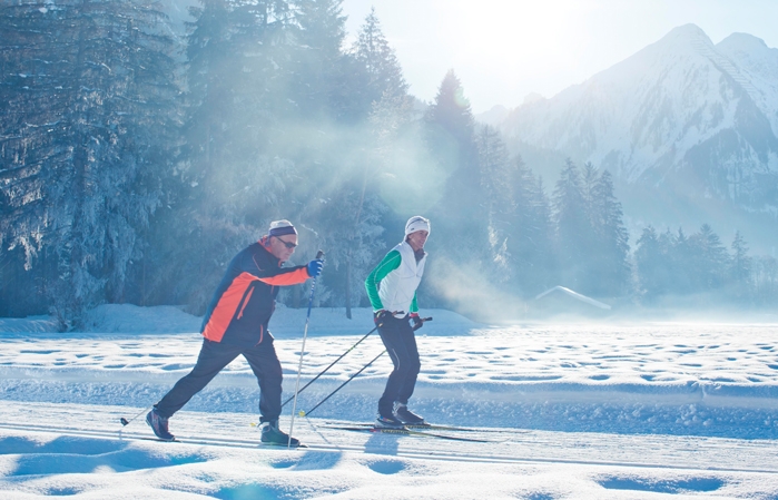 Two people cross-country skiing
